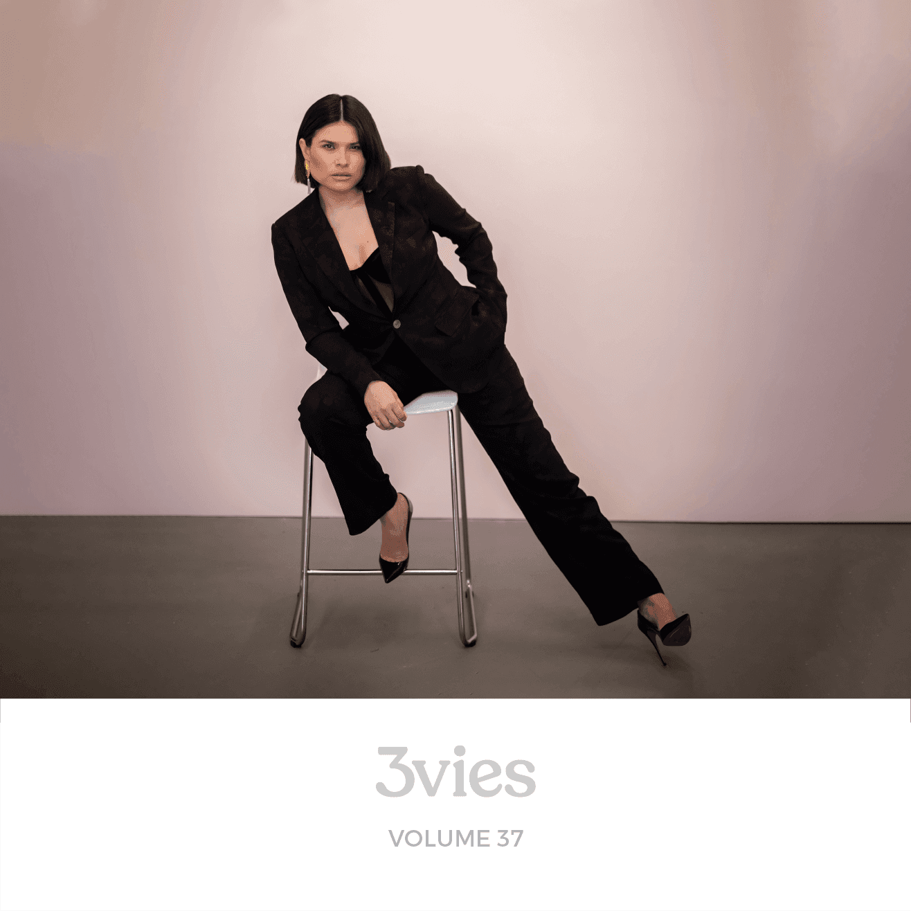 Spotify playlist cover for 3vies Volume 37, featuring the cover portrait of a woman in a black suit.