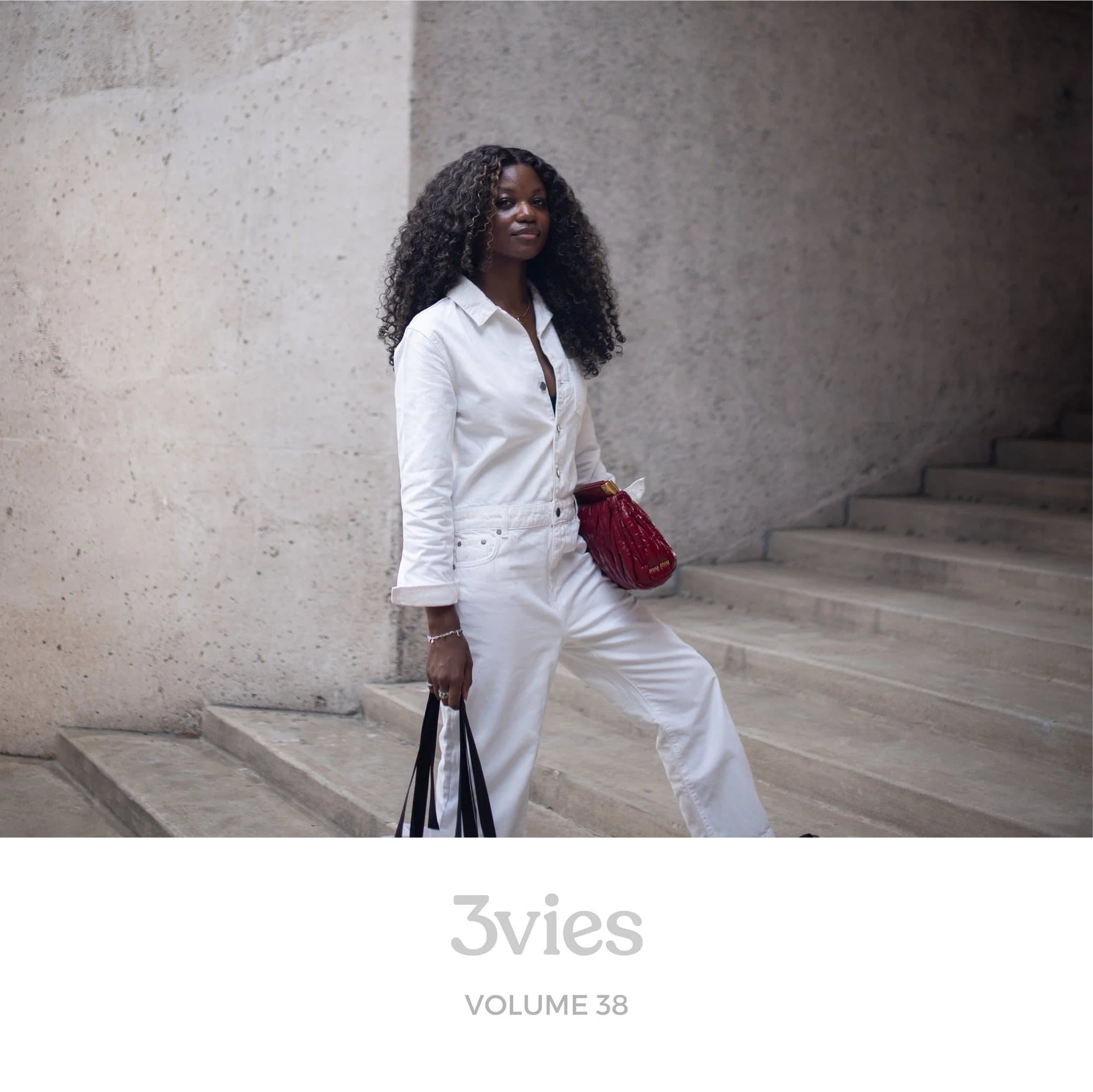 Spotify playlist cover for 3vies Volume 38, featuring the cover portrait of a woman in white on stone steps.