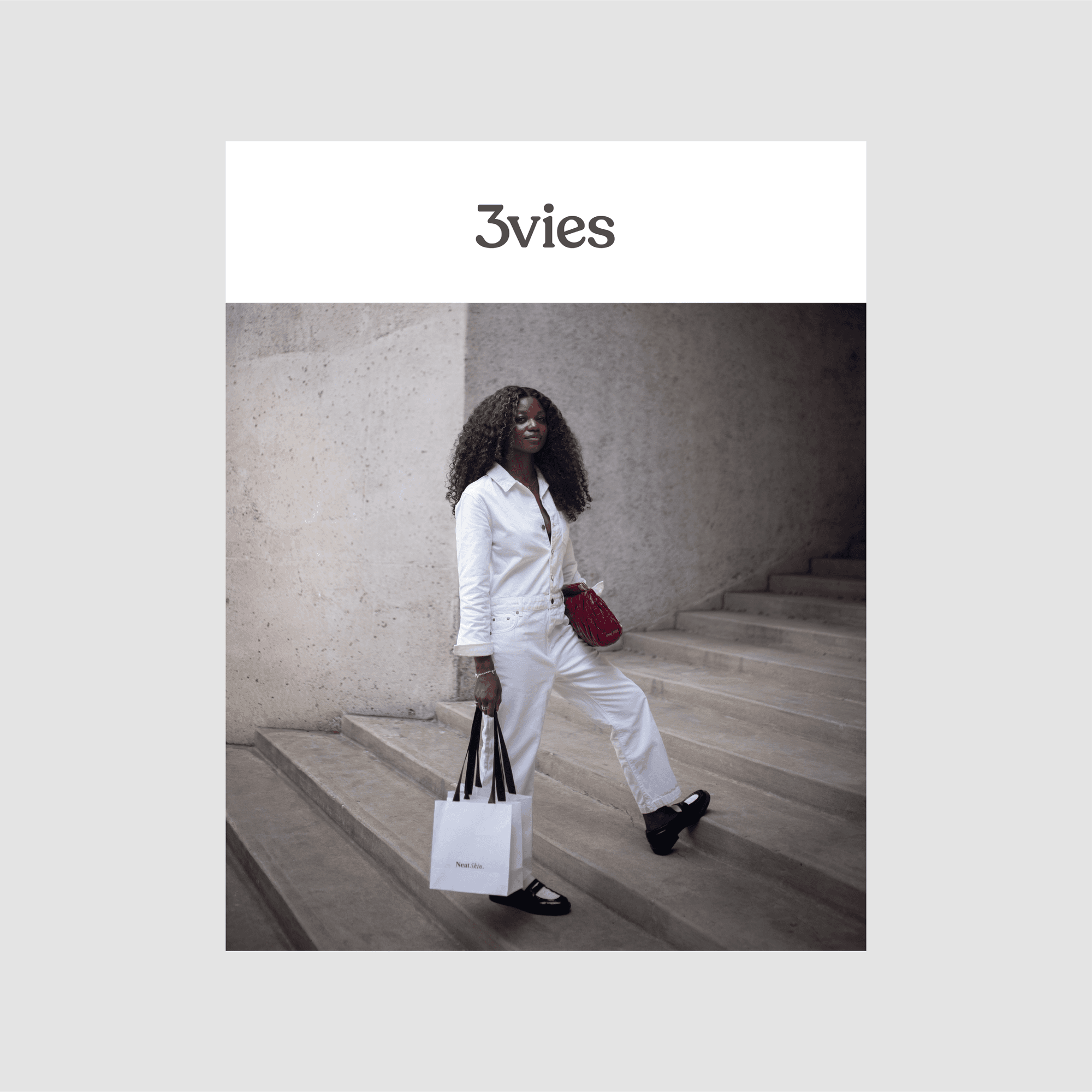 Cover of 3vies magazine Volume 38, Looking: Zola-Ludivine Luvualo in white on concrete steps.