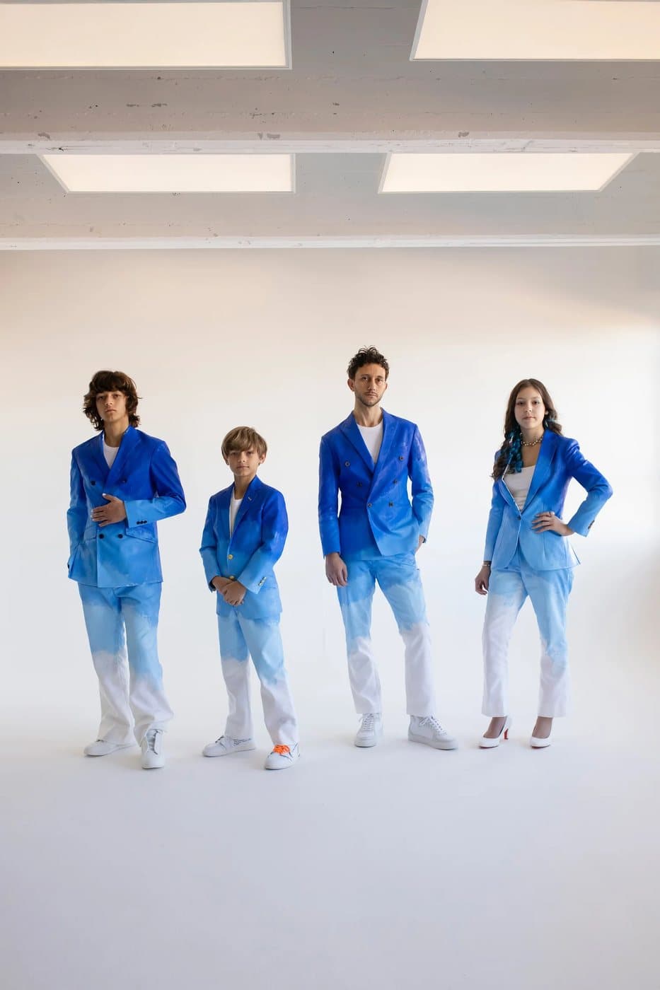 To the Future, a TIMELESS archival print of Mark and his three children in blue ombre Timeless suits.