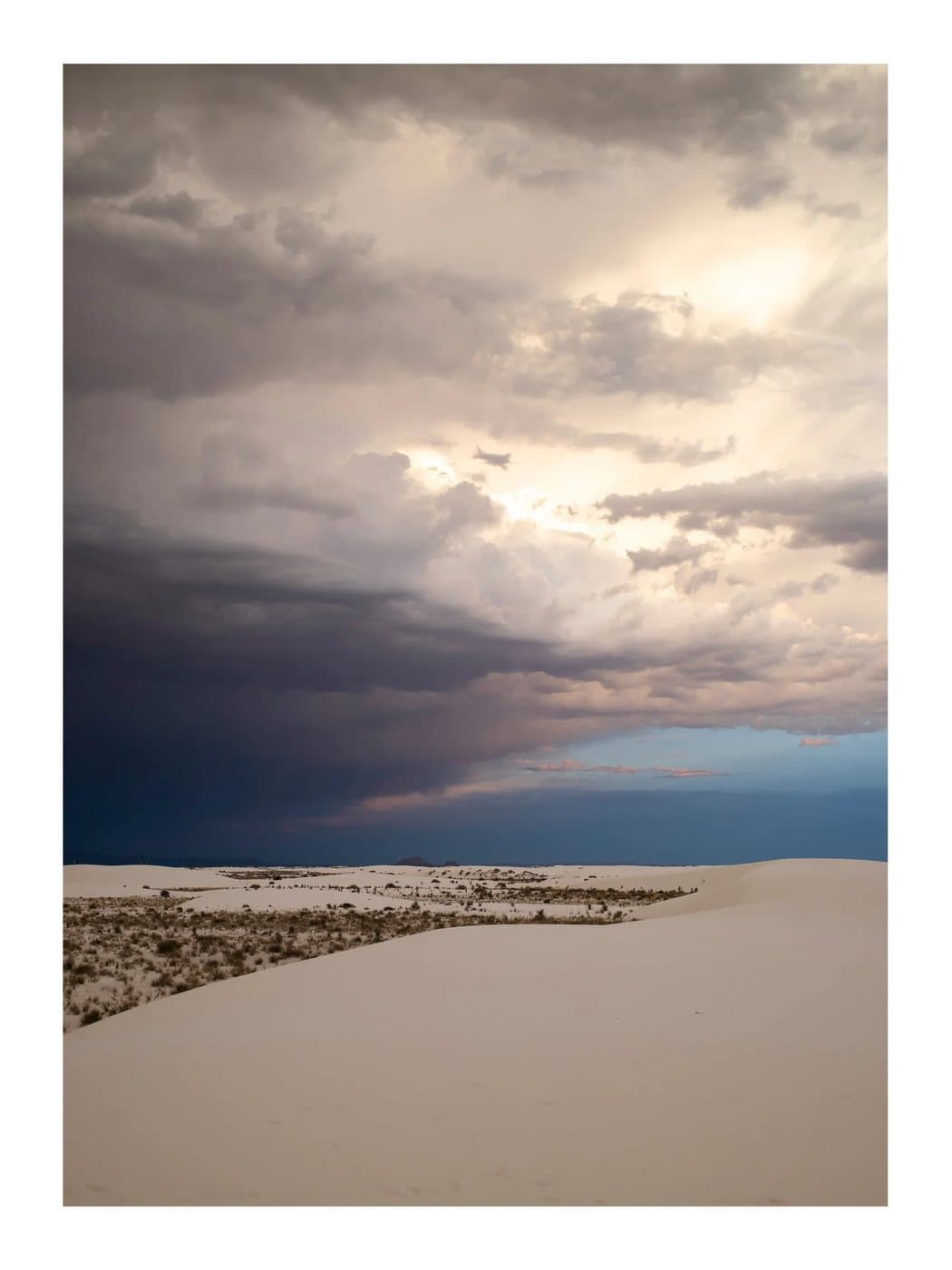 White Sands, a TIMELESS archival print of storm clouds breaking over pale gypsum dunes.