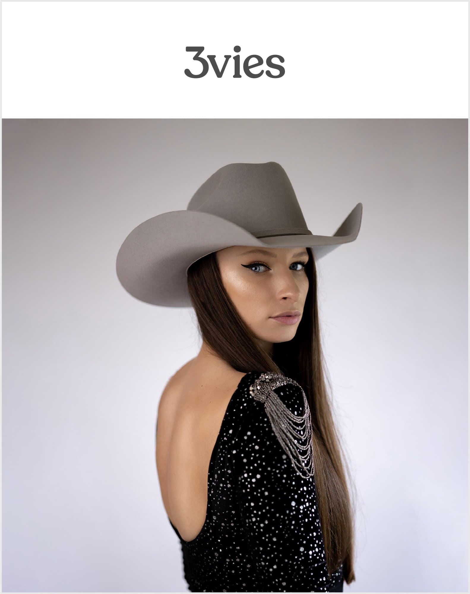Cover of 3vies Volume 36, Love, a woman in a gray cowboy hat and sequined backless top.