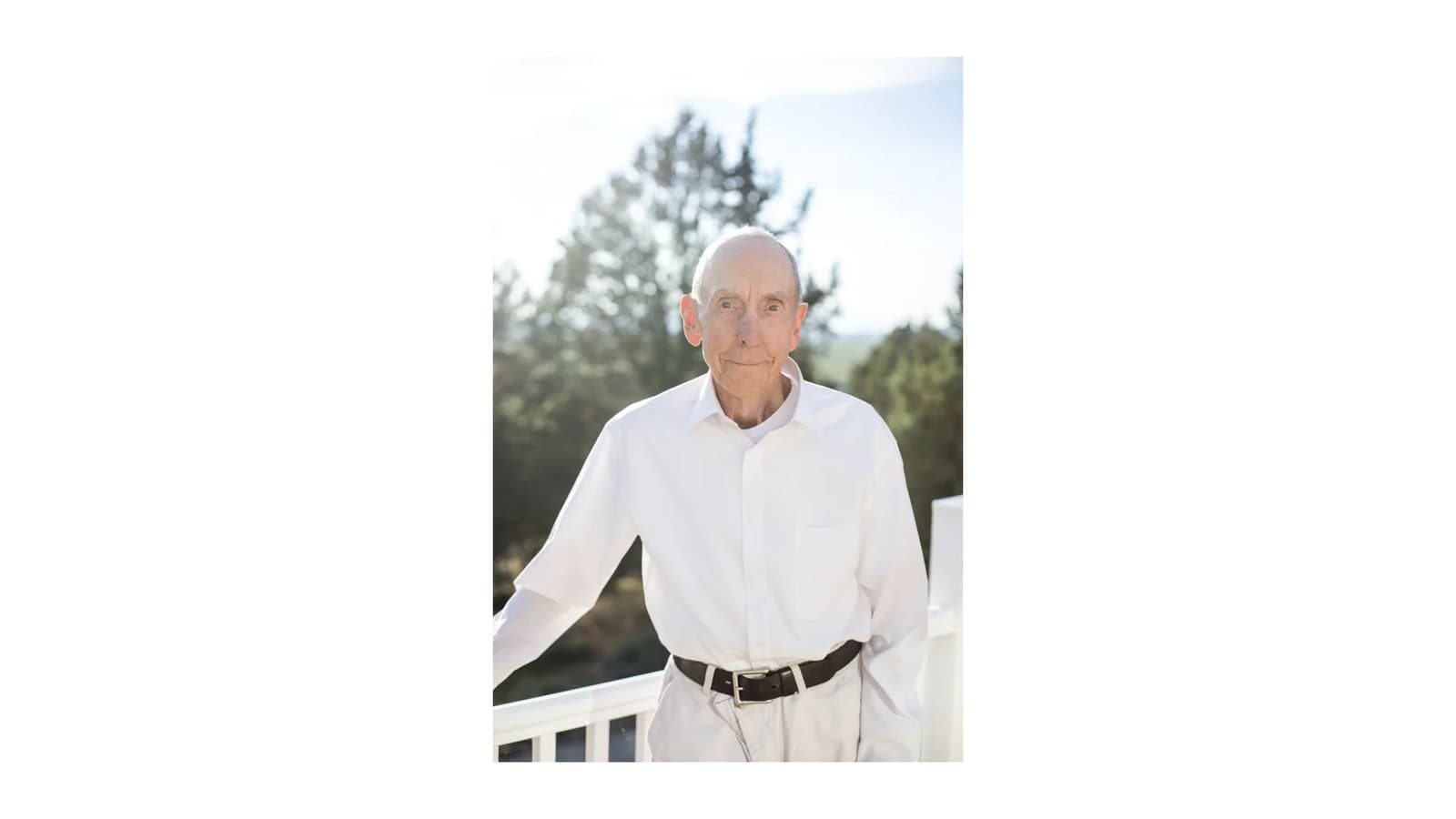 Keynote slide with a portrait of an older man in a white shirt on a porch.